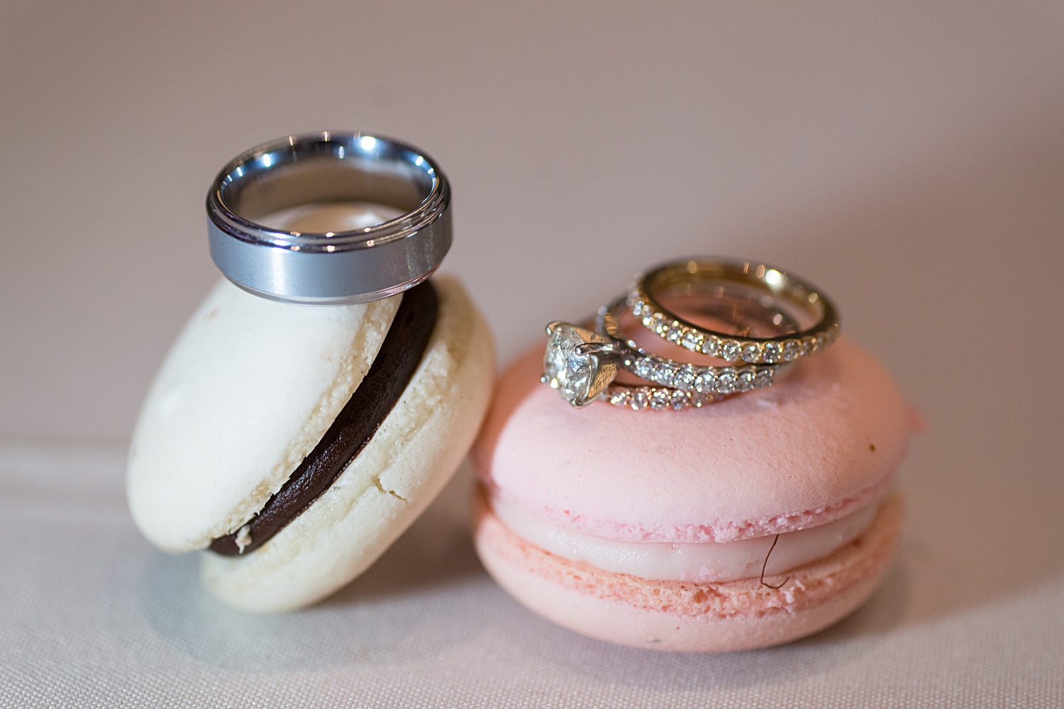 Ring photo with macaroons. Brass on Baltimore Wedding Photos in downtown KC. KC wedding photographers.