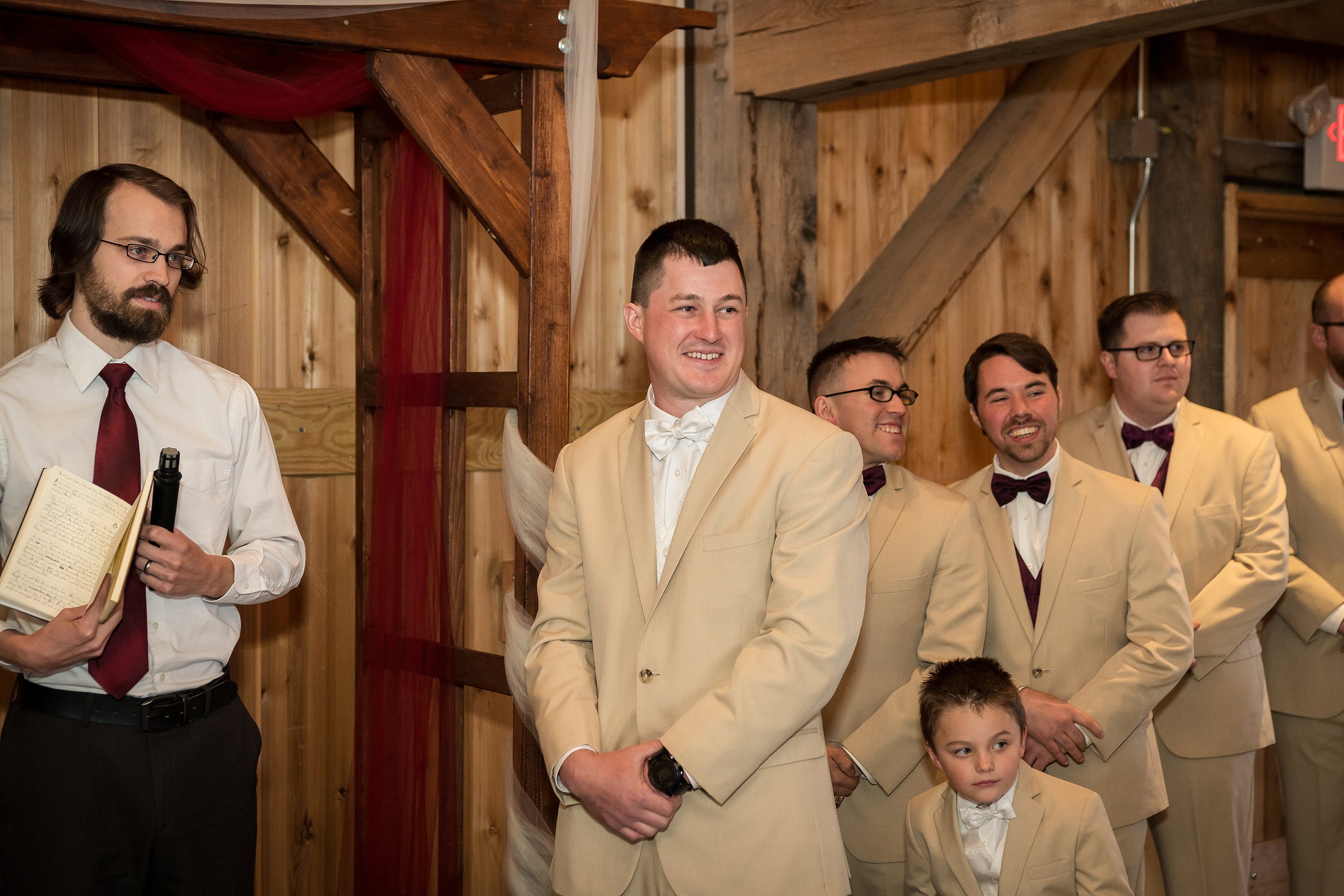 Groom's reaction to seeing bride at ceremony. Wedding-Ceremony-Photos-The-Barn-at-Kill-Creek-Wedding-Photos-De-Soto-KS-Emily-Lynn-Photography